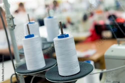 Fabric industry production line. Textile factory. Working tailoring process