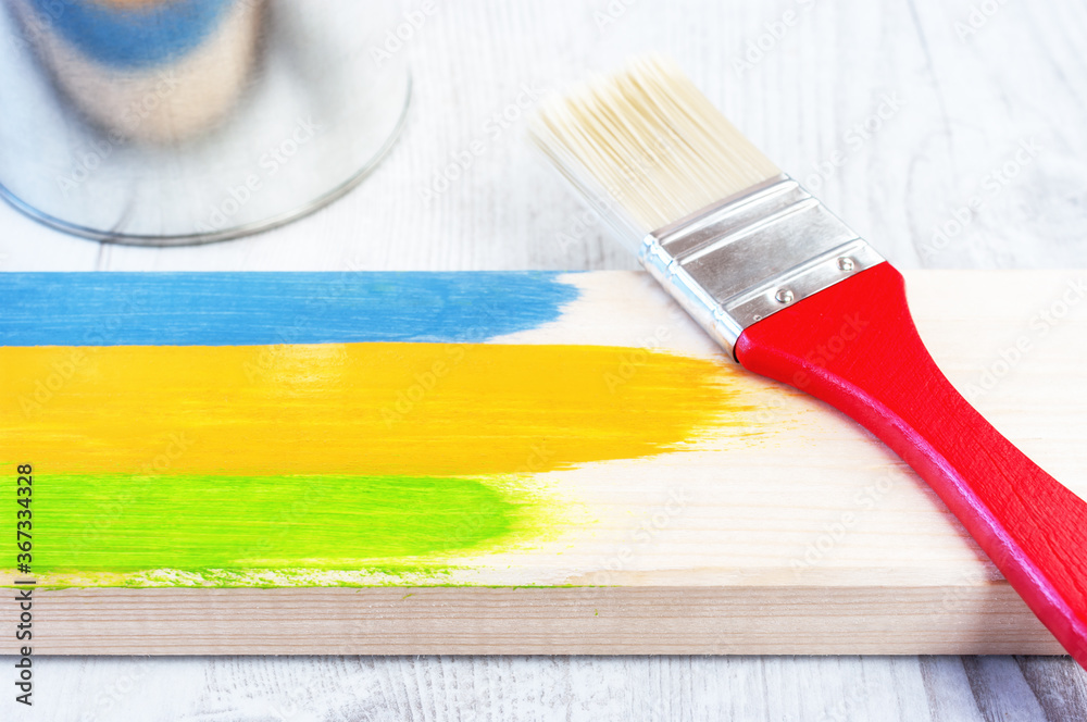 Paint brush on wooden surface