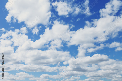 Clouds in blue sky. White  fluffy clouds In blue sky. Background nature. Texture cumulus floating on blue sky. Backgrounds concept. Environment  atmosphere. Place for an inscription or logo