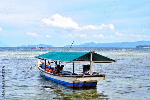 Beautiful scenery of boat on the sea at Indonesia © evri15