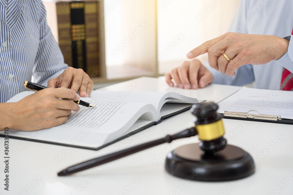 Professional Secretary lawyer working at his office signing contract Consultation of client from trust Law Firm, Attorneys Notary Law and Legal services concept Professional Secretary lawyer working at his office signing contract Consultation of client from trust Law Firm, Attorneys Notary Law and Legal services concept