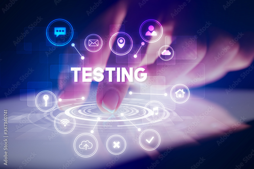 Finger touching tablet with web technology icons and TESTING inscription, web technology concept Finger touching tablet with web technology icons and TESTING inscription, web technology concept