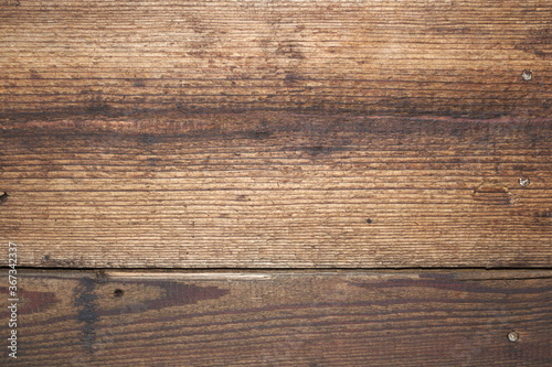 Part of an old wall made of wooden boards close up, background image
