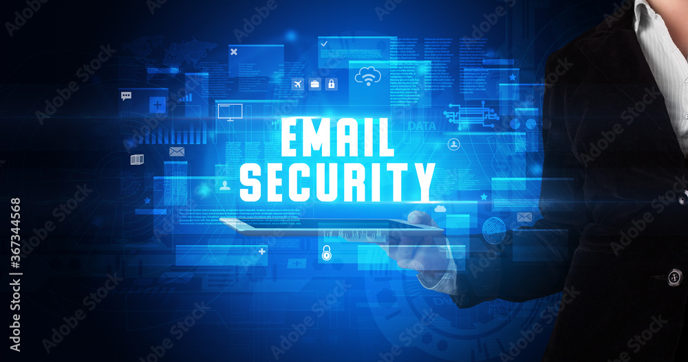 Young business person working on tablet and shows the digital sign: EMAIL SECURITY Young business person working on tablet and shows the digital sign: EMAIL SECURITY
