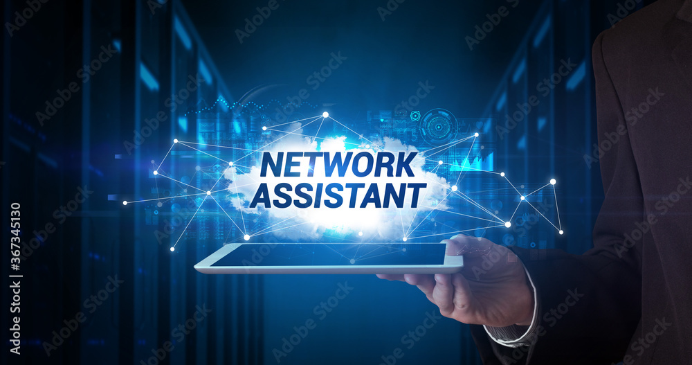 Young business person working on tablet and shows the inscription: NETWORK ASSISTANT Young business person working on tablet and shows the inscription: NETWORK ASSISTANT