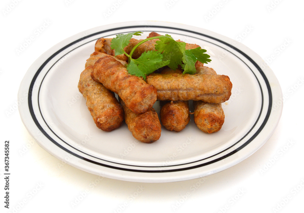 Cooked sausages arranged in white plate on white background Cooked sausages arranged in white plate on white background