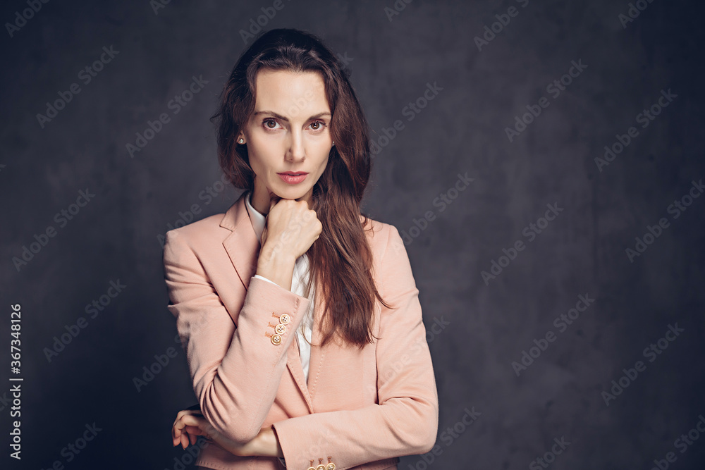 Depressed adult caucasian woman on dark background Depressed adult caucasian woman on dark background
