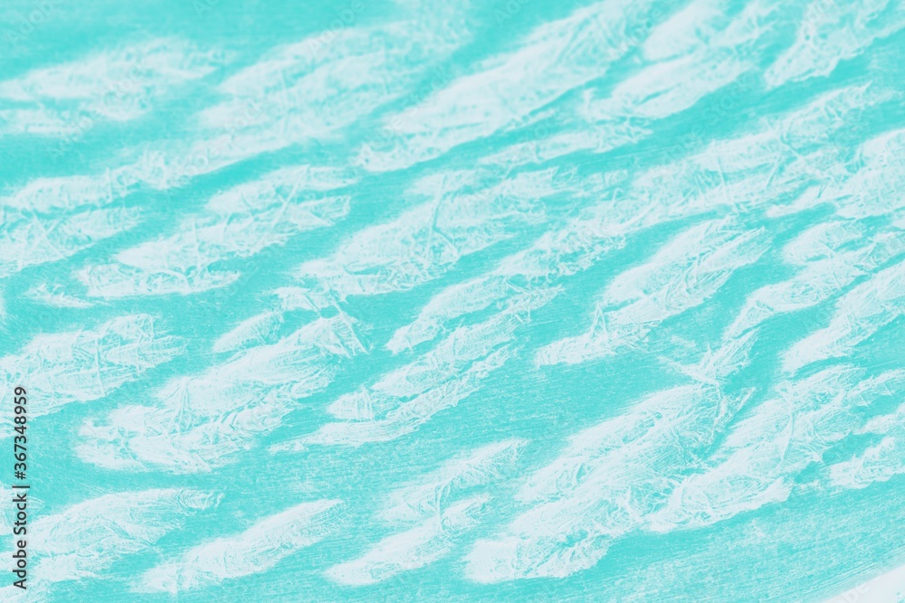 Bright patchy aquamarine background with white spots
