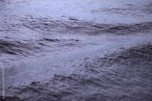 Waves on water surface. Wave pattern. View of surface fresh or sea water. Lapping sea waves. Background of sea or ocean wave. Water surface Wallpaper or background concept. Noise photo ripples water © Alex Vog