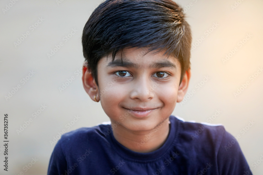 Happy indian child playing at ground Happy indian child playing at ground