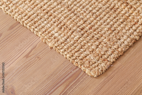 Laminated parquet floor. Light wood texture. Modern cozy soft carpet. Warm interior design