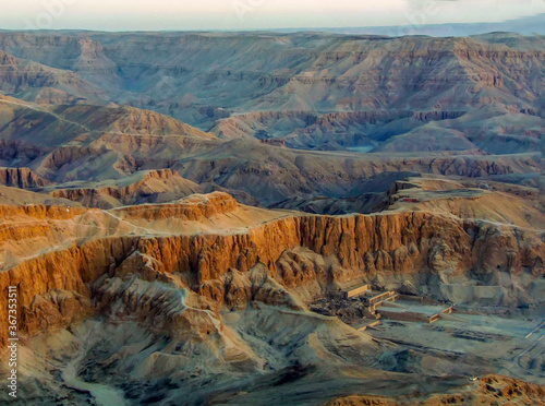 A panorama view from a hot air balloon over the Temple of Hatshepsut and the Valley of the Kings on the east bank of the Nile near Luxor, Egypt in summer photo