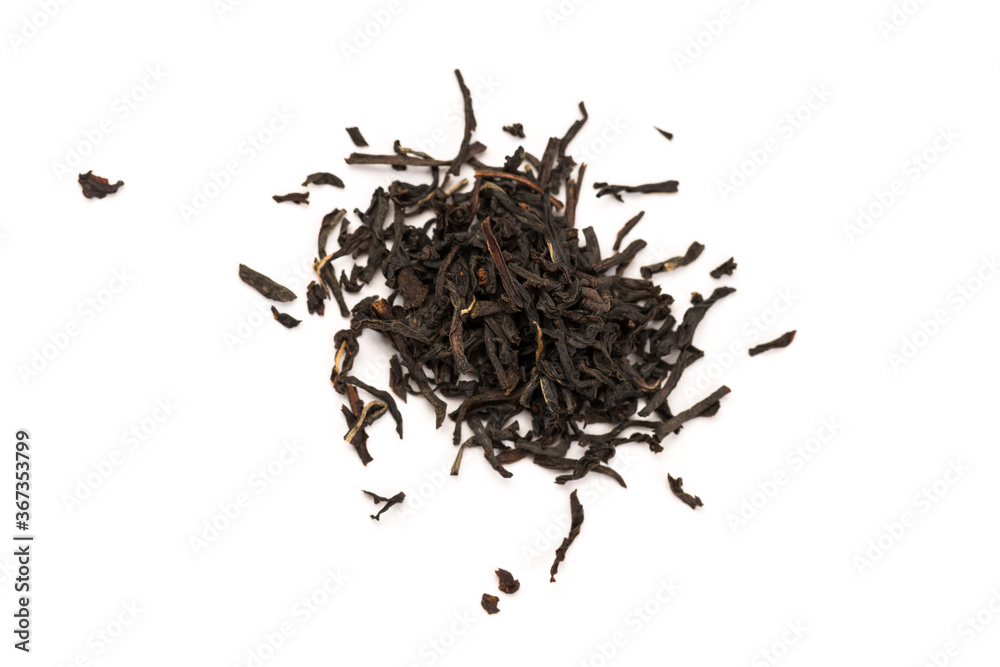 Fototapeta premium Leaves of black premium dry tea on a white background