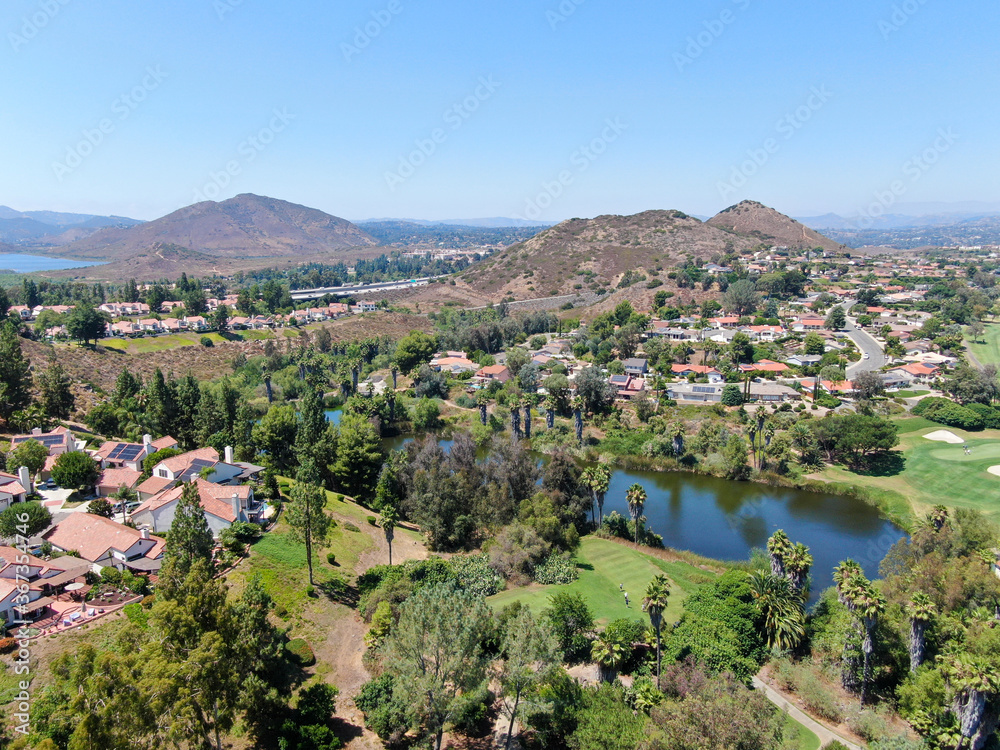 Aerial view of residential neighborhood surrounded by golf in green valley, Rancho Bernardo, San Diego County, California. USA. 