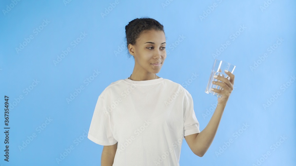 Afro-American Girl Activist With plastic and glass cups on blue background Afro-American Girl Activist With plastic and glass cups on blue background