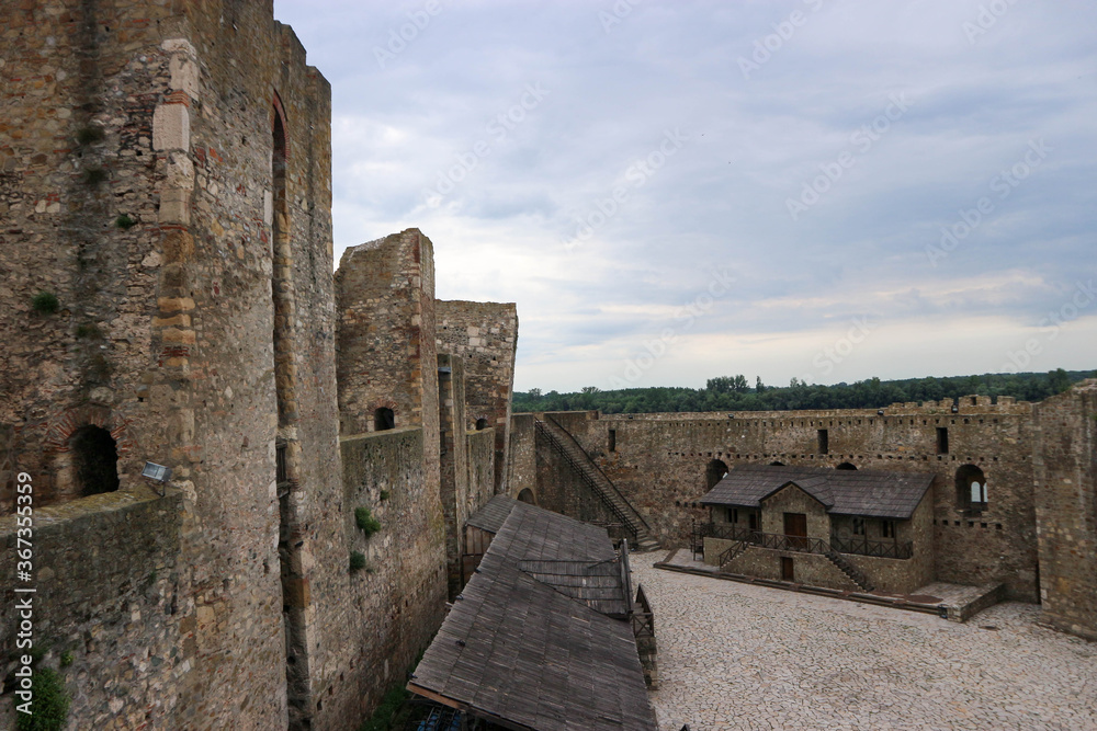 View from the citadel wall to courtyard of old medieval Smederevo fortress in Serbia with buildings inside