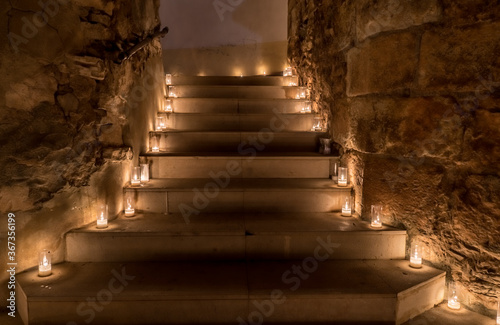 Titaguas village, streets illuminated by candles drawing shapes on the night of the candles celebration local july festival at Valencia Spain