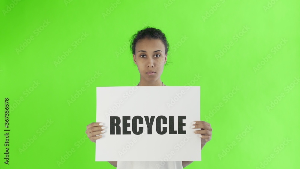 Afro-American Girl Activist With Recycle Poster showing thumb up on chroma key background Afro-American Girl Activist With Recycle Poster showing thumb up on chroma key background