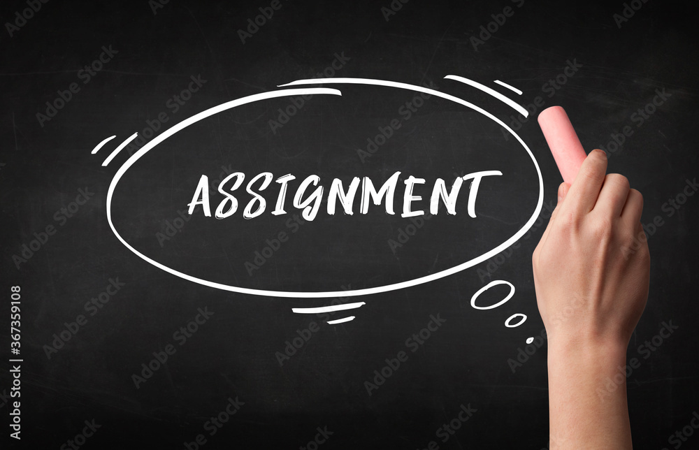Hand drawing ASSIGNMENT inscription with white chalk on blackboard, education concept Hand drawing ASSIGNMENT inscription with white chalk on blackboard, education concept