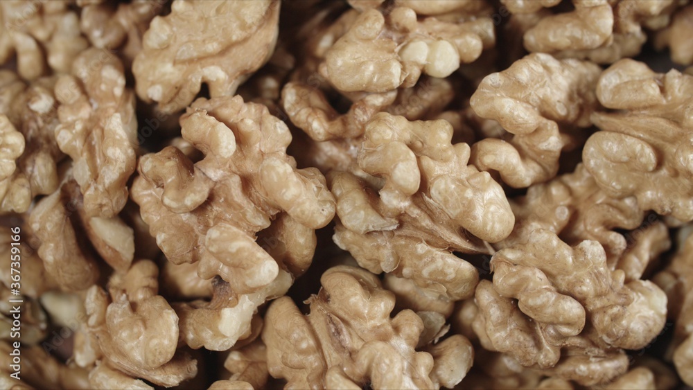 Dry walnut background, close up nut, rotation top view. Food background Dry walnut background, close up nut, rotation top view. Food background