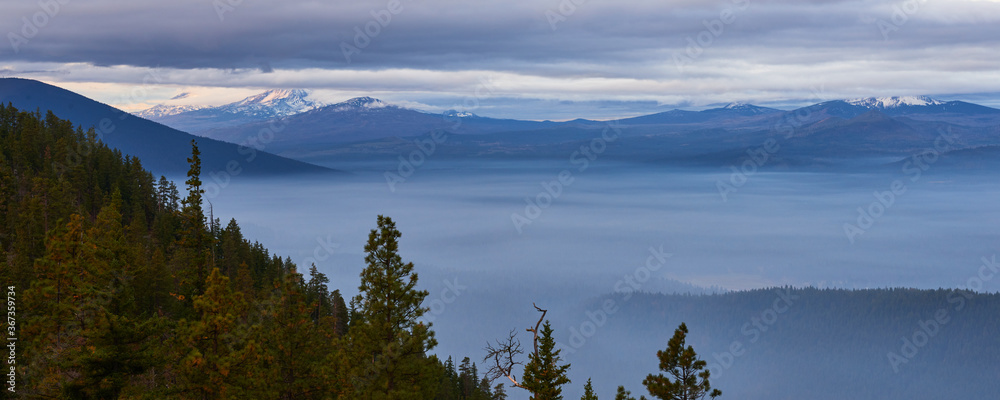 Foggy mountain valley in the morning. Panoramic view from Green Ridge Lookout in Central Oregon.