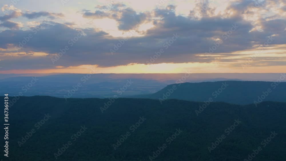 An aerial shot (dolly out, track right) above the Massanutten Range in George Washington National Forest in Page County, VA. An aerial shot (dolly out, track right) above the Massanutten Range in George Washington National Forest in Page County, VA.