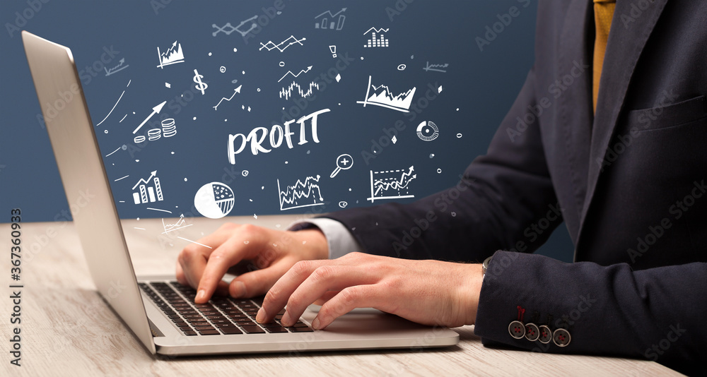 Businessman working on laptop with PROFIT inscription, modern business concept Businessman working on laptop with PROFIT inscription, modern business concept