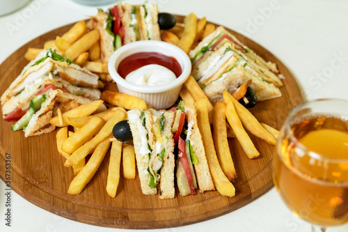 Club sandwich with french fries and ketchup