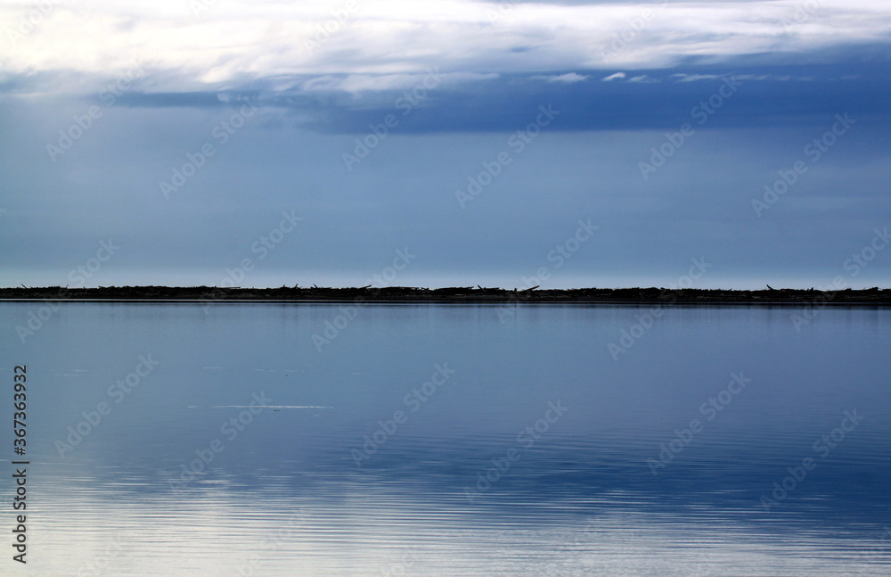 Pristine water scenes with reflections and brilliant blue skies Pristine water scenes with reflections and brilliant blue skies