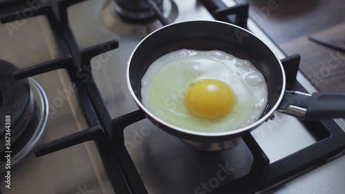 Top view of Cooking eggs in a frying pan.