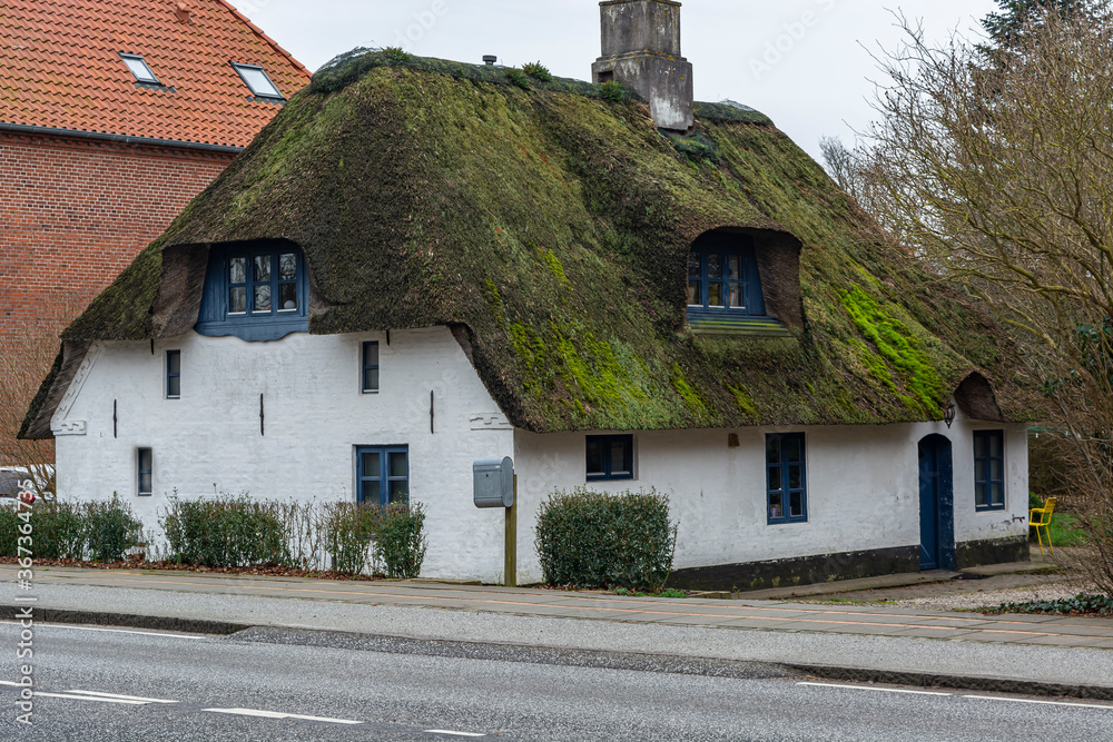 old apartment building, thatched roof. Housing in Europe