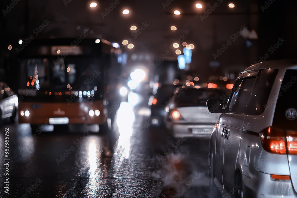 Fototapeta premium traffic of cars in the night city, view from the car, lights abstract auto background