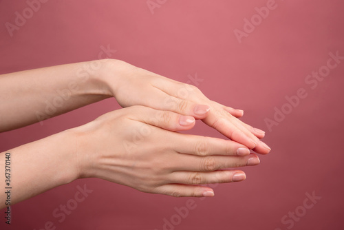 wrist on pink background  caring for  skin of  hands  delicate young skin  aging hands  beautiful manicure  self-care  young body 