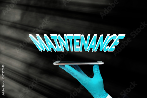 Writing note showing Maintenance. Business concept for the process of maintaining or preserving someone or something Displaying Sticker Paper Accessories With Medical Gloves On photo