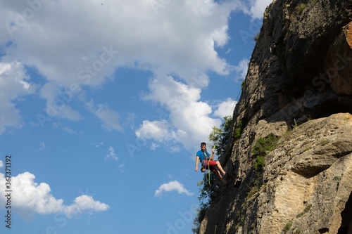 Man climbing a mountain.