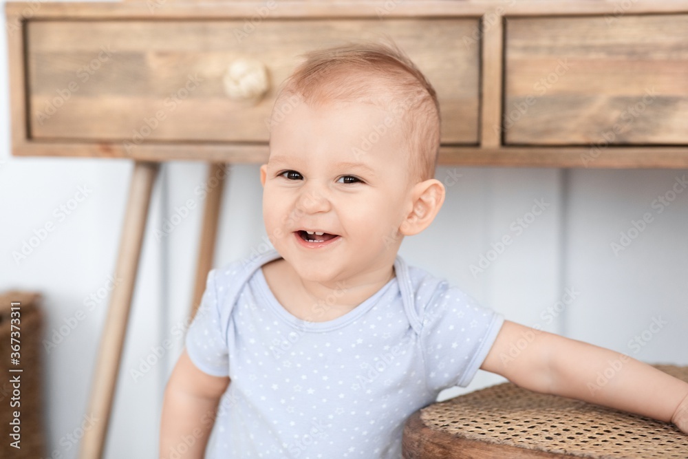 Baby Portrait. Adorable Smiling Toddler Boy Posing At Home, Looking At Camera