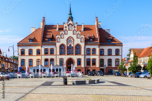 PISZ TOWN, POLAND - JUN 27, 2020: Town hall on square in Pisz town, Masurian Lakes region, Poland. photo