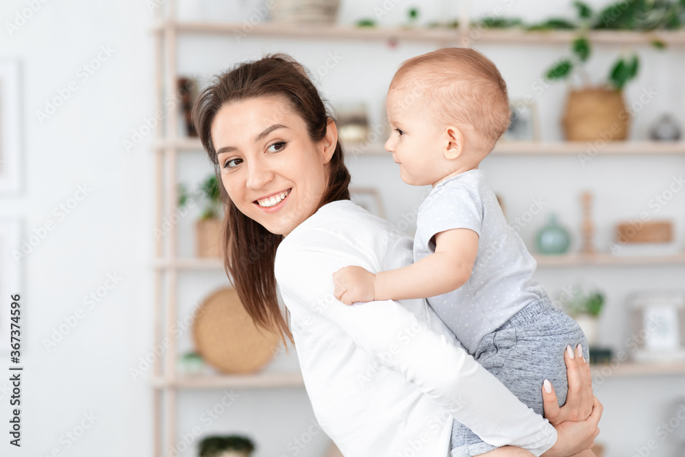 Mother Baby Activities. Happy Young Mom Playing With Baby Son At Home Mother Baby Activities. Happy Young Mom Playing With Baby Son At Home