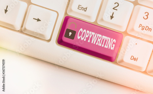 Word writing text Copywriting. Business photo showcasing writing the text of advertisements or publicity material Different colored keyboard key with accessories arranged on empty copy space
