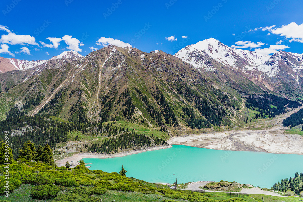Amazing view of a mountain lake in front of a mountain range, Almaty city national park, Kazakhstan Amazing view of a mountain lake in front of a mountain range, Almaty city national park, Kazakhstan