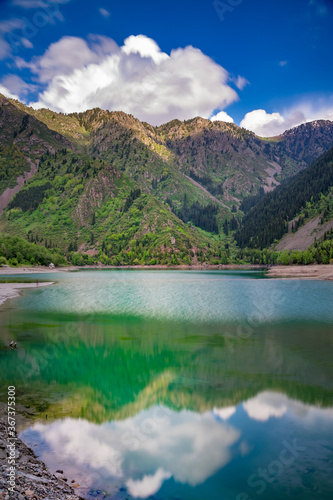 Amazing view of a mountain lake in front of a mountain range, Almaty city national park, Kazakhstan