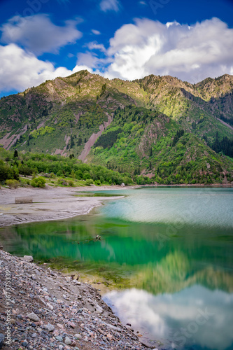 Amazing view of a mountain lake in front of a mountain range, Almaty city national park, Kazakhstan