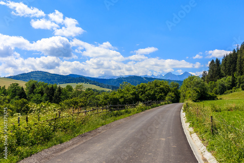 Cycling road from Osturnia to Kacwin village in Tatra Mountains on Poland Slovakia border on beautiful summer sunny day