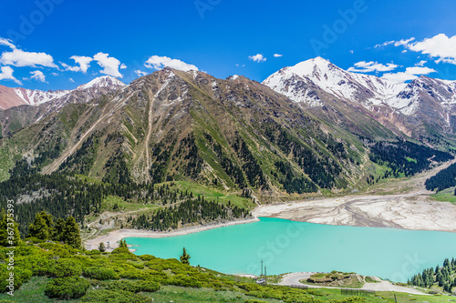 Amazing view of a mountain lake in front of a mountain range, Almaty city national park, Kazakhstan