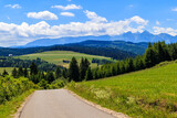 Cycling road from Kacwin to Lapsze Nizne village in Tatra Mountains on beautiful summer sunny day, Poland