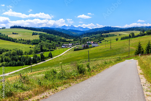 Cycling road from Kacwin to Lapsze Nizne village in Tatra Mountains on beautiful summer sunny day, Poland