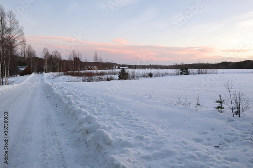 Lonely street in wintertime in the countryside of Lapland, Sweden