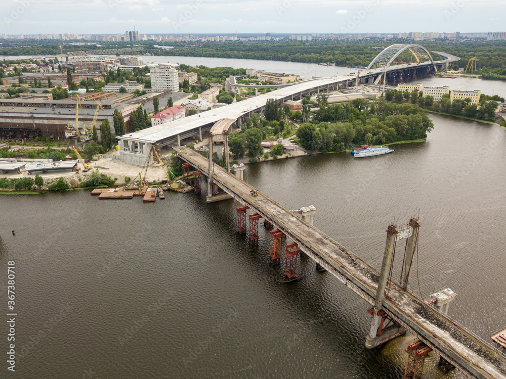 Aerial drone view. Reconstruction of a bridge over the Dnieper river in Kiev.