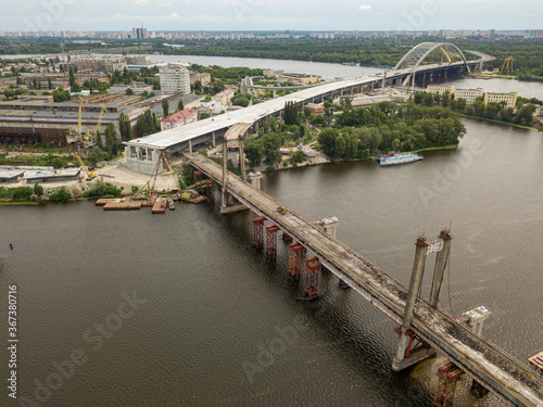 Aerial drone view. Reconstruction of a bridge over the Dnieper river in Kiev.