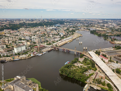 Aerial drone view. Construction of a bridge across the Dnieper river in Kiev. © Sergey